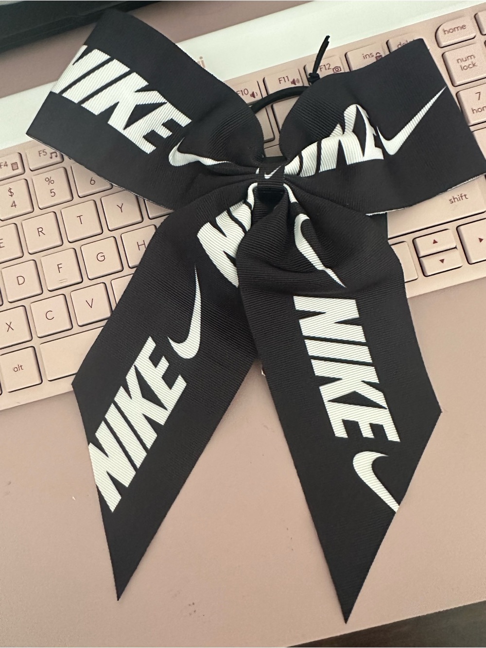 NWT Nike Black & White Logo “Cheer” Bow Hair Tie. Never used, original tag.